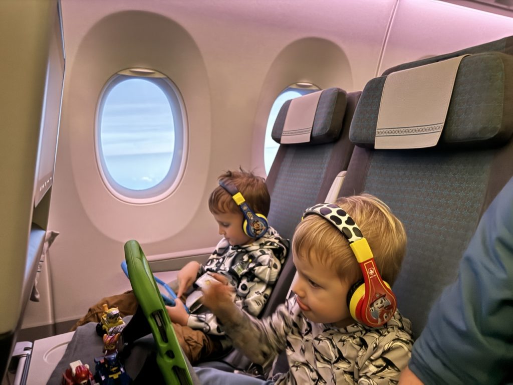 Toddler on Fiji Airways flight sitting in economy class