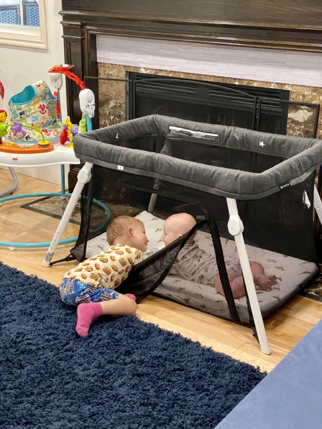 Baby lounging in the best travel crib