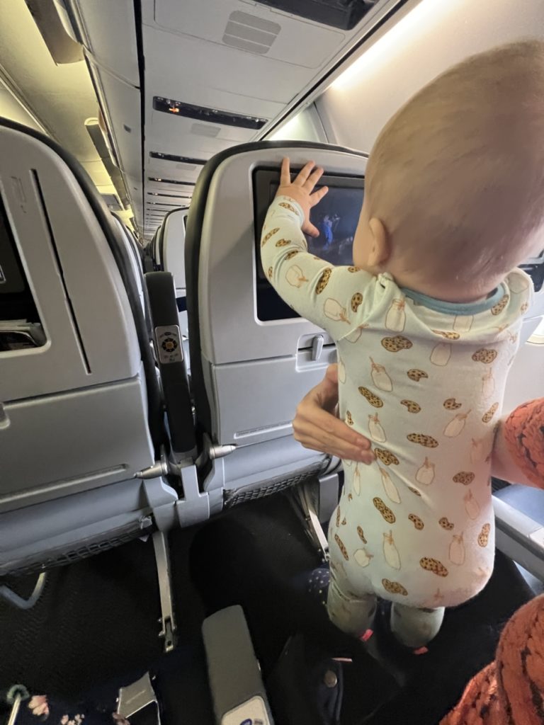 Flying United with lap infant